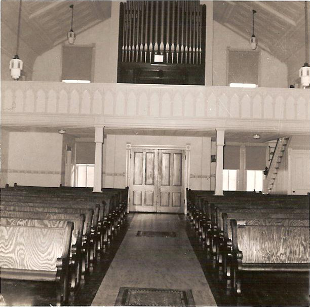 View from chancel toward rear of church, showing pipe organ loft, c. 1950s